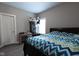 Second bedroom with a queen bed and plenty of storage at 6611 Ventnor Pl, Indianapolis, IN 46217