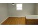 Simple dining area with hardwood floors and a window at 535 E Merrill St, Indianapolis, IN 46203