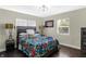 Cozy bedroom with floral bedding and wood floors at 1938 E 11Th St, Indianapolis, IN 46201