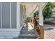 Inviting front porch with wooden railings and steps leading to the entrance at 1938 E 11Th St, Indianapolis, IN 46201