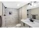 Basement bathroom with marble shower and modern vanity at 1938 E 11Th St, Indianapolis, IN 46201