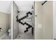 Modern shower with black and white hexagon tile, built-in bench and rainfall shower head at 1938 E 11Th St, Indianapolis, IN 46201