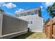 Side view of a gray house with a fenced backyard at 1938 E 11Th St, Indianapolis, IN 46201
