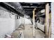 Unfinished basement with exposed pipes and HVAC system at 1938 E 11Th St, Indianapolis, IN 46201