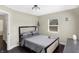 Guest bedroom with gray bedding and wood floors at 1938 E 11Th St, Indianapolis, IN 46201