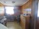 Small bedroom with wood-paneled walls and dresser at 610 W Monroe St, Alexandria, IN 46001