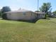 Ranch house with brick exterior, and a large grassy yard at 610 W Monroe St, Alexandria, IN 46001