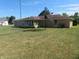 Back of house with sunroom and satellite dish at 610 W Monroe St, Alexandria, IN 46001
