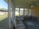 Bright sunroom with seating area and lots of windows at 610 W Monroe St, Alexandria, IN 46001