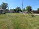 Large grassy backyard with a chain link fence and some trees at 610 W Monroe St, Alexandria, IN 46001