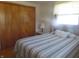 Bright bedroom with double bed, closet, and wood flooring at 610 W Monroe St, Alexandria, IN 46001
