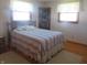 Serene bedroom with a double bed and hardwood floors at 610 W Monroe St, Alexandria, IN 46001