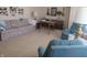 Living room with floral sofa and two teal armchairs at 610 W Monroe St, Alexandria, IN 46001