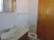 Clean bathroom with white tile, toilet, and vanity at 610 W Monroe St, Alexandria, IN 46001