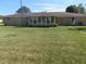 Back of the house showing sunroom addition and yard at 610 W Monroe St, Alexandria, IN 46001