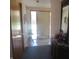 Bright entryway with wood floors and access to the exterior at 610 W Monroe St, Alexandria, IN 46001