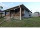 Brick home with a front porch and well-maintained lawn at 305 Leeds Ave, Indianapolis, IN 46201