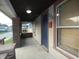 Front porch with brick columns and a blue door at 305 Leeds Ave, Indianapolis, IN 46201