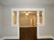 Dining room with hardwood floors and view to kitchen at 305 Leeds Ave, Indianapolis, IN 46201