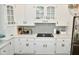 Modern kitchen with white cabinets, quartz countertops, and stainless steel appliances at 2838 Silverwood Ln, Greenwood, IN 46143