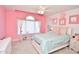 Charming bedroom with pink walls, window seat and decorative accents at 2838 Silverwood Ln, Greenwood, IN 46143