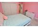 Light and airy bedroom with pink walls and ample closet space at 2838 Silverwood Ln, Greenwood, IN 46143