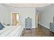 Spacious primary bedroom with hardwood floors and ensuite bathroom access at 2838 Silverwood Ln, Greenwood, IN 46143