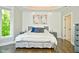 Main bedroom with shiplap accent wall and hardwood floors at 2838 Silverwood Ln, Greenwood, IN 46143