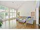 Bright living room with hardwood floors, large windows, and sectional sofa at 2838 Silverwood Ln, Greenwood, IN 46143