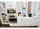 Built-in oven and microwave in a white kitchen with quartz countertops at 2838 Silverwood Ln, Greenwood, IN 46143