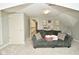 Spacious bonus room with a couch, shelving and access to hallway at 2838 Silverwood Ln, Greenwood, IN 46143