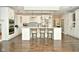 Spacious kitchen with white cabinets, a large island, and hardwood floors at 2838 Silverwood Ln, Greenwood, IN 46143