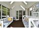 Bright porch with two swings and access to the kitchen at 2838 Silverwood Ln, Greenwood, IN 46143