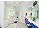Elegant bathroom with blue vanity, soaking tub, and walk-in shower at 2838 Silverwood Ln, Greenwood, IN 46143