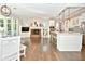 Eat-in kitchen with island, hardwood floors, and brick fireplace at 2838 Silverwood Ln, Greenwood, IN 46143