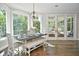 Bright dining area with hardwood floors and access to sunroom at 2838 Silverwood Ln, Greenwood, IN 46143