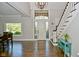Bright entryway with hardwood floors, staircase and glass door at 2838 Silverwood Ln, Greenwood, IN 46143