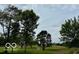 View of a lush green golf course with trees and fairways at 980 Paris Dr, Franklin, IN 46131