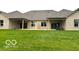 Spacious backyard with a large patio and grassy area at 980 Paris Dr, Franklin, IN 46131
