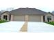 Brick duplex with attached garages and a shared driveway at 980 Paris Dr, Franklin, IN 46131