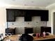 Modern kitchen with dark cabinetry and geometric backsplash tile at 980 Paris Dr, Franklin, IN 46131