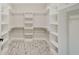 Large walk-in closet with built-in shelves and rods at 2841 Grandview Ln, Greenwood, IN 46143