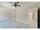 Spacious bedroom with ceiling fan and access to kitchen at 2841 Grandview Ln, Greenwood, IN 46143