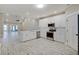 Modern kitchen featuring white cabinets, stainless steel appliances, and an island at 2841 Grandview Ln, Greenwood, IN 46143