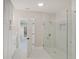 Bathroom featuring a glass shower and marble tile at 2841 Grandview Ln, Greenwood, IN 46143