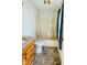 Clean bathroom with tub, toilet, and wood vanity at 4322 Par Dr, Indianapolis, IN 46268