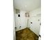 Small laundry room with shelving and tile floor at 4322 Par Dr, Indianapolis, IN 46268