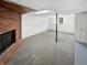 Spacious basement with brick fireplace and carpeted floor at 2647 Sheffield Dr, Indianapolis, IN 46229