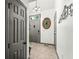 Bright entryway with tile flooring and a gray door at 9644 Highgate N Cir, Indianapolis, IN 46250