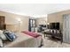Bright bedroom with a queen bed, wood floors, and a home office area at 9644 Highgate N Cir, Indianapolis, IN 46250